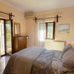 Bedroom with built-in wardrobe in residence for sale in South Corfu