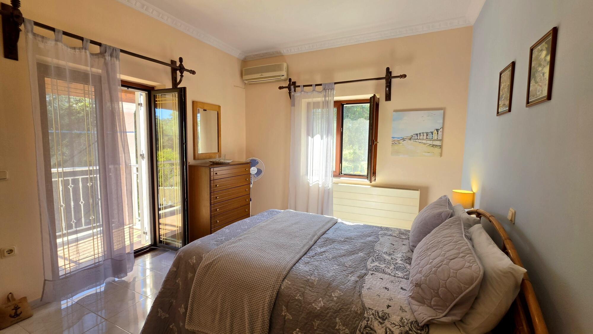 Bedroom with built-in wardrobe in residence for sale in South Corfu