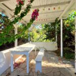 Outdoor sitting area and garden of house in Argyrades, South Corfu