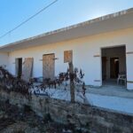 Exterior view of unfinished apartment complex in Agios Georgios South, Corfu
