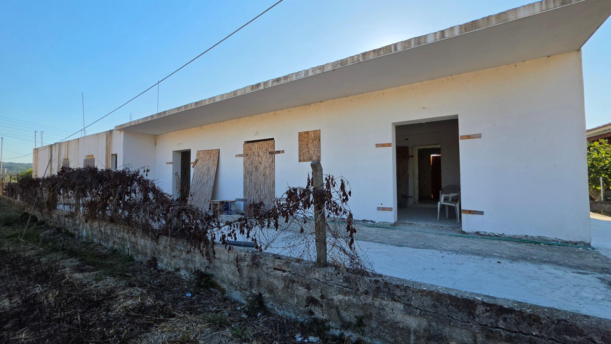 Exterior view of unfinished apartment complex in Agios Georgios South, Corfu