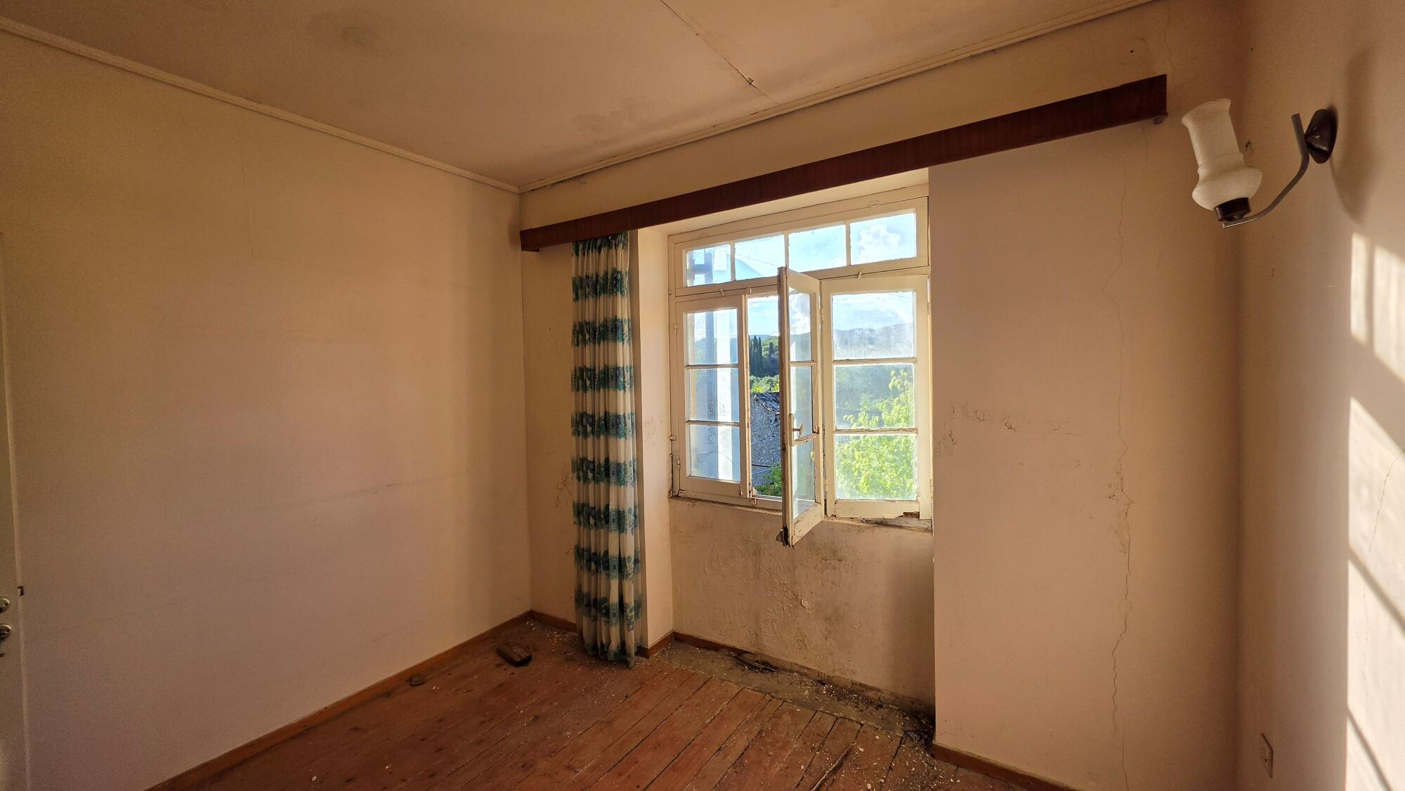 Rooms on first floor of traditional stone property in northern Corfu