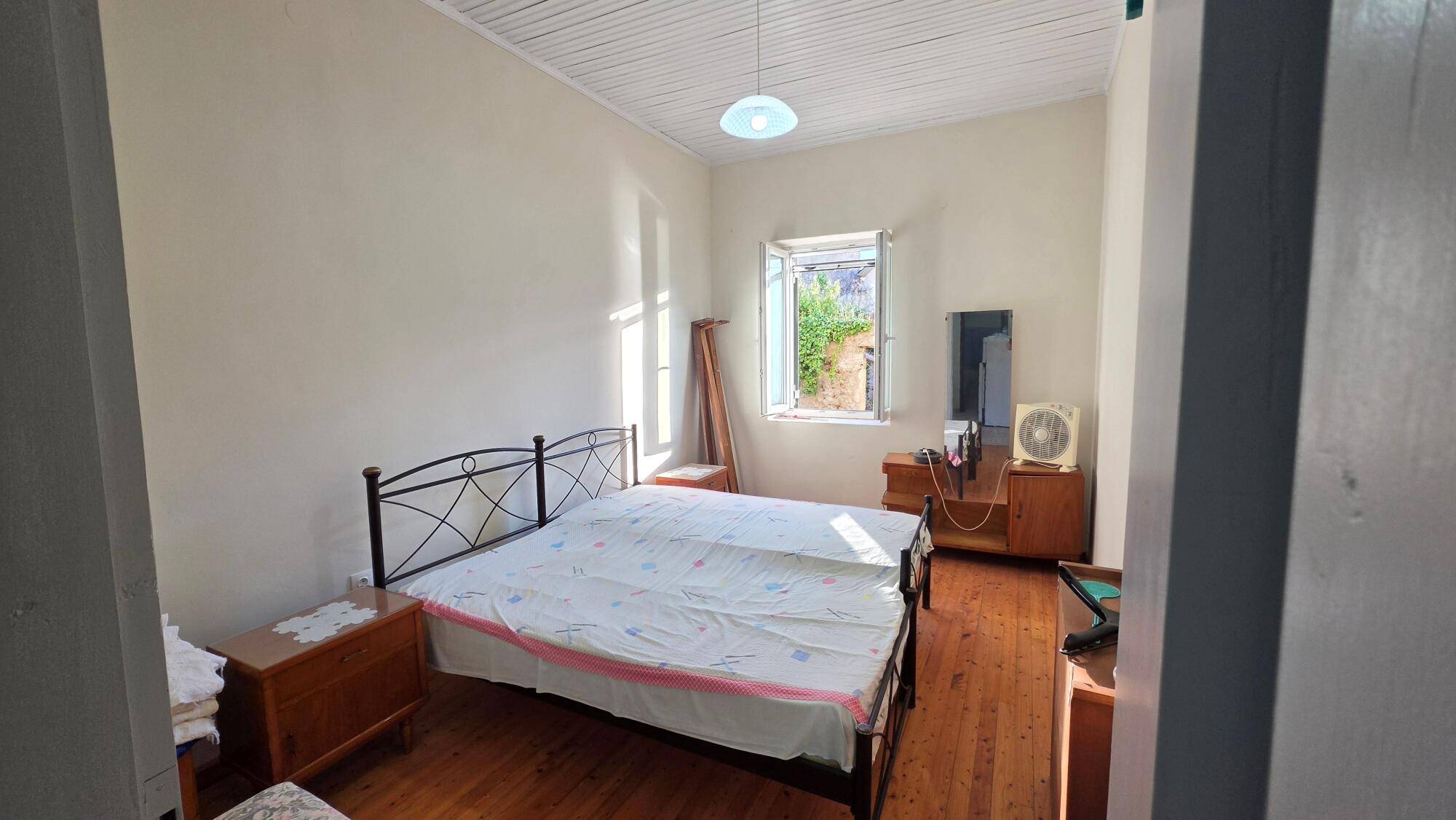 Bedroom in traditional stone house in Agioi Douli, Corfu