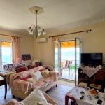Open-plan lounge kitchen and dining area in a sea-view apartment in North East Corfu