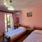 Second bedroom with balcony in a traditional village house in Chlomos