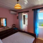 First bedroom with sea views in a traditional house in Chlomos, Corfu